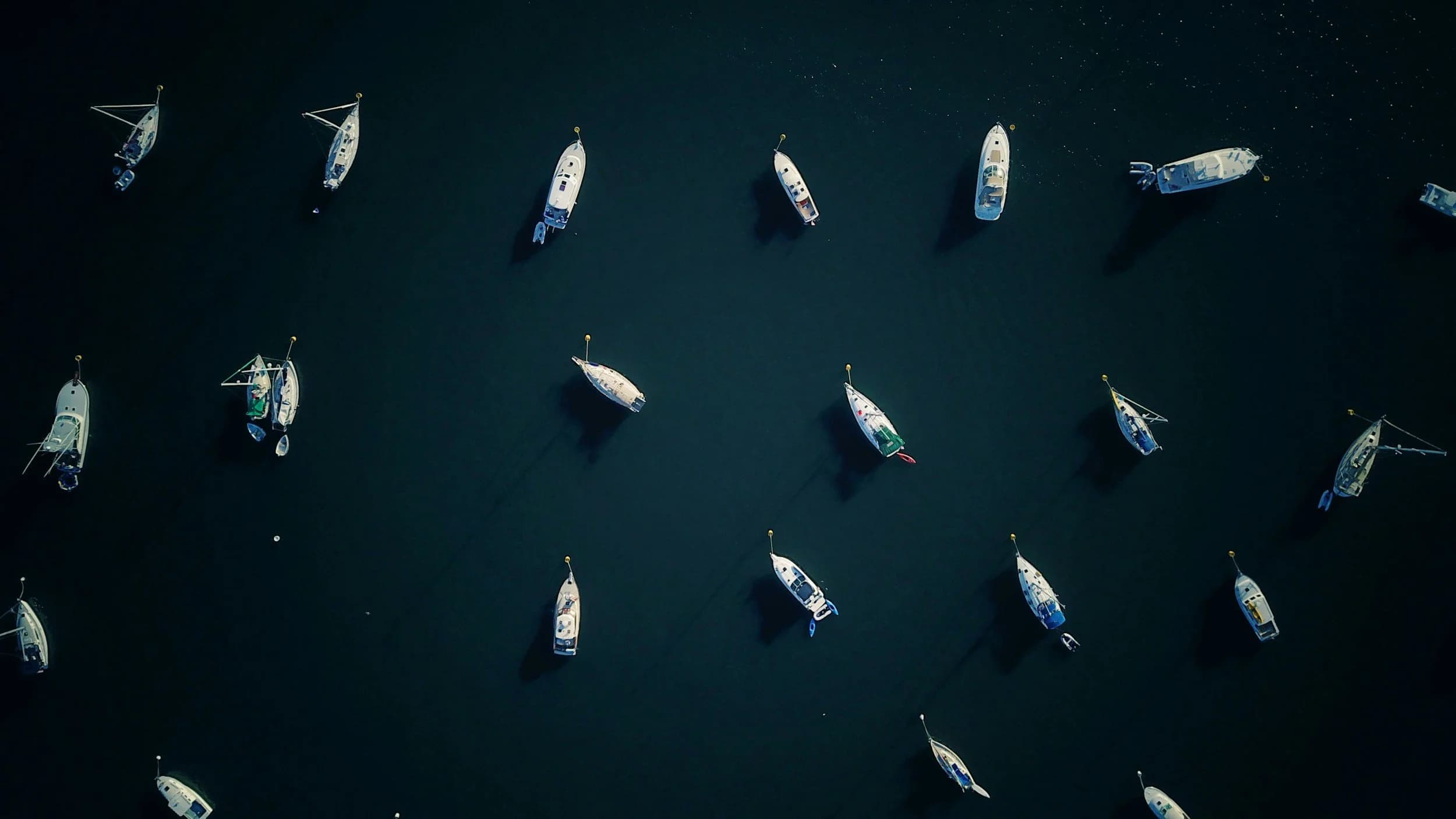 Aerial view of a sailboat off the Cape Ann coast in Massachusetts
